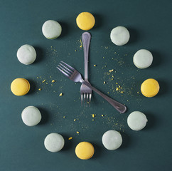Modern clock done with forks and macaroons