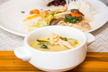 Green curry in white cup, Fried Vegetables and rice in a white dish  for breakfast.