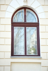 Vintage building with arched wooden window