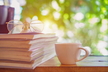 A white cup of coffee on wood table