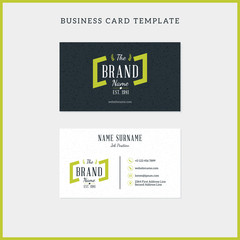 Obraz premium Double-sided vintage business card template with retro typographic logo and black textured background. Vector illustration. Stationery design