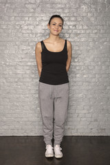 woman in sports dress poses for a photo