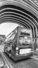 Fotobehang Red bus fast moving along Tower Bridge, London © jovannig