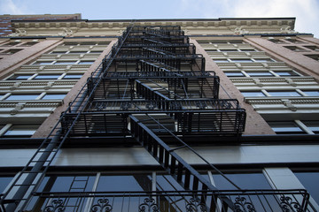 Dramatic Upward Skyward View, Tall City Building, Brick Front, Black Fire Escape/Stairs, Daytime - Portland, Oregon
