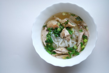 Bowl of chicken pho. Pho ga. Rice noodle soup.