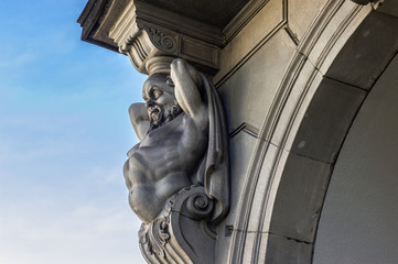 Obraz premium Atlas sculpture on a house facade in Zurich , Switzerland