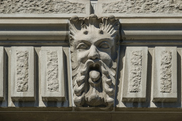 relief  statue of a bearded man on a facade in Zurich , Switzerland