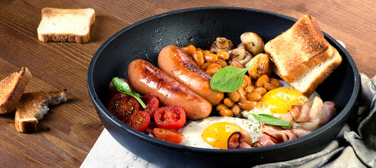 Full English breakfast with fried eggs, sausages
