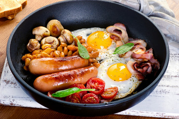 Full English breakfast with fried eggs