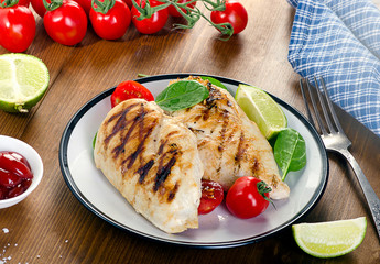 Grilled chicken breasts with fresh tomatoes