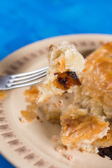 Slice of burek on the fork with blurred background