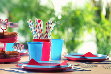 Table setting with plastic ware for summer picnic
