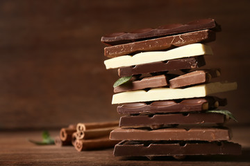 Stack of chocolate bars on wooden table