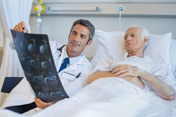 Doctor showing patient xray