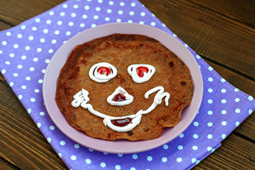 Chocolate pancake for kids. Breakfast. The concept of food and vegetarian.