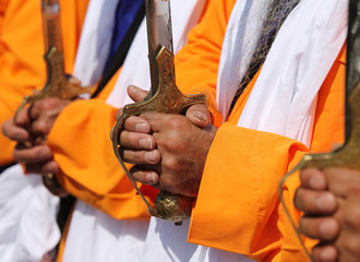 hands of the Sikh religious men during the religious ceremony