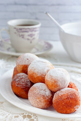Freshly baked cheese donuts with powdered sugar, selective focus