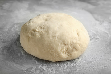 Raw dough on kitchen table, closeup
