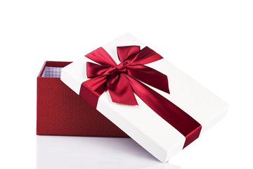 Empty open gift box with red bow 