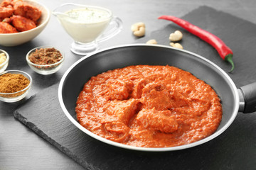 Murgh Makhani in frying pan on table