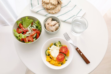 Composition with tasty yogurt on table in room