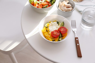 Composition with tasty yogurt on table in room