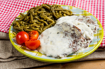 juicy steak veal beef meat with tomato and vegetables