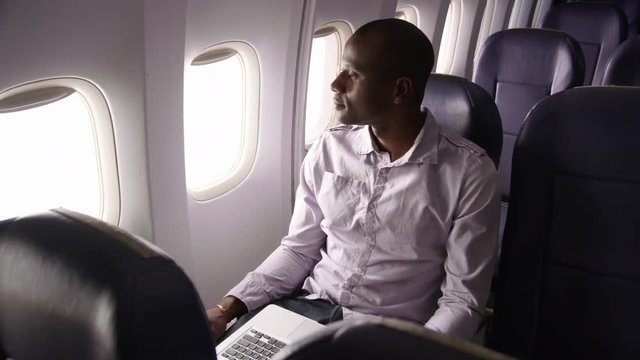 Man resting on airplane flight