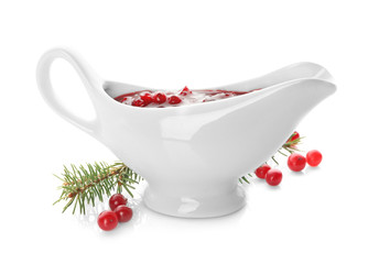 Delicious cranberry sauce in boat on white background