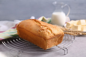 Baked butter cake with ingredients on table
