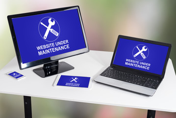 Website maintenance concept on different devices