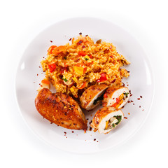 Stuffed chicken fillet with rice and vegetables on white background