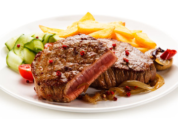 Grilled beefsteak with french fries on white background