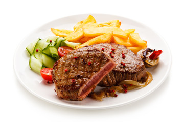 Grilled beefsteak with french fries on white background