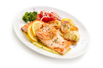 Grilled salmon with potatoes on white background