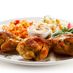 Grilled drumsticks on white background
