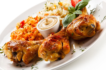 Grilled drumsticks on white background