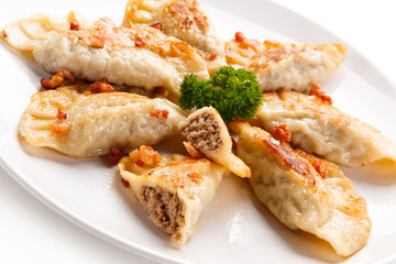 Dumplings - stuffed noodles on white background