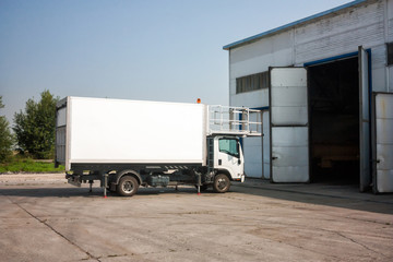 Airport catering truck near garage boxes