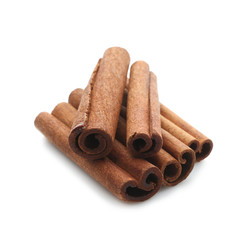 Heap of cinnamon sticks isolated on white, closeup