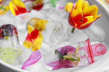 Homemade popsicles with flowers in serving dish