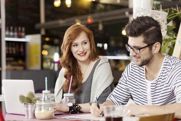 Freelance couple enjoying coffee break