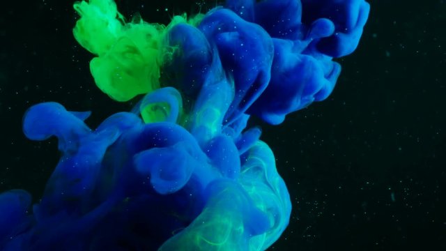 Green and Blue Paint Mixes in Tanker Full of Black Water thus Creating Psychedelic Shifting Forms.Shot on RED EPIC-W 8K Helium Cinema Camera.