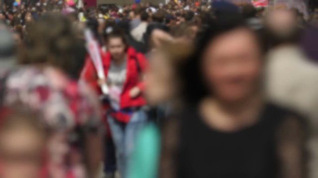 Time lapse with motion blur of thick crowd of people.
