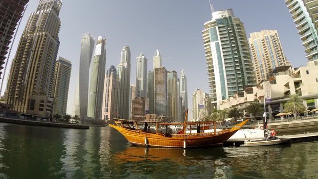 Rotating timelapse video of Dubai Marina canal. View of the towers and the harbor.