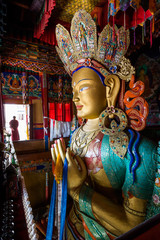 Colourful sculpture of Maitreya Buddha at Thiksey monastery in the Indian Himalaya. Thiksey, Ladakh, India