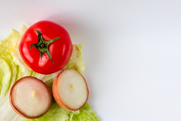 Tomato, cabbage, onion on the white background.. With place for inscription. Diet