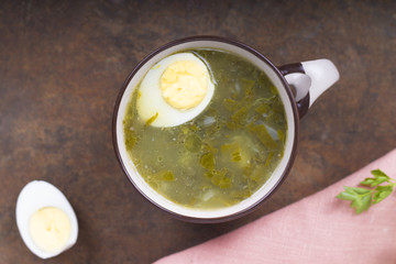 Soup of sorrel and young greens with egg