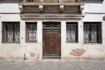 Vintage timber dooor on the old building facade