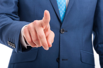 Closeup of salesman finger pressing on virtual screen